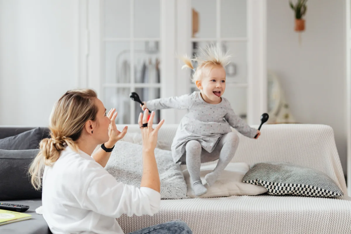 Mother and daughter sharing a joyful moment at home